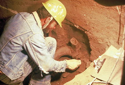 Miles at work uncovering the bighorn sheep in the Natural Trap Cave, Wyoming.